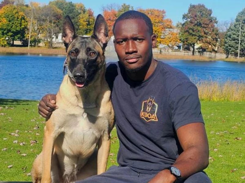 Mo with Belgian Malinois by lake, K9 Obedience Academy dog trainer Rochester NY